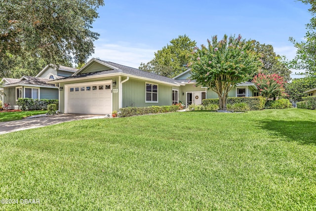 view of front of house featuring a garage and a front yard