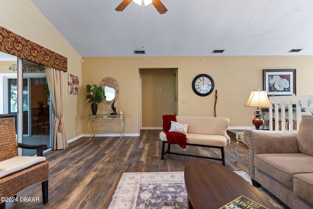 living room featuring dark hardwood / wood-style flooring, vaulted ceiling, and ceiling fan