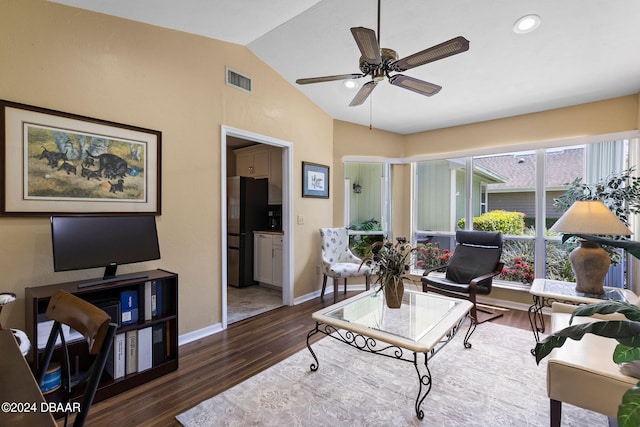 living room with dark hardwood / wood-style flooring, lofted ceiling, and ceiling fan