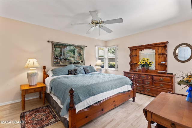 bedroom featuring ceiling fan and light hardwood / wood-style floors