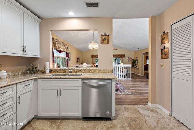 kitchen featuring white cabinetry, sink, vaulted ceiling, dishwasher, and kitchen peninsula