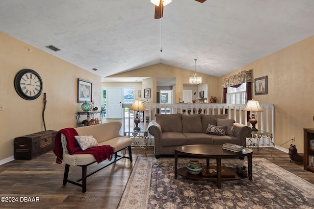 living room featuring lofted ceiling, ceiling fan with notable chandelier, plenty of natural light, and dark hardwood / wood-style flooring