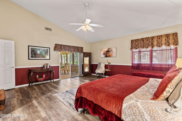 bedroom with dark wood-type flooring, ceiling fan, and high vaulted ceiling