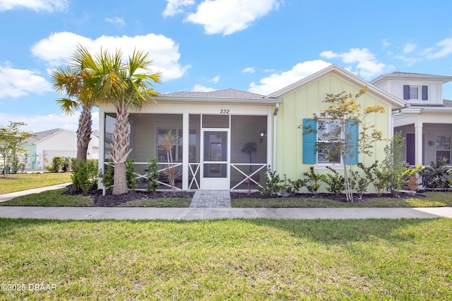 232 Ocean Hammock Loop, Daytona Beach, FL 32124 - view of front of property featuring a sunroom and a front yard