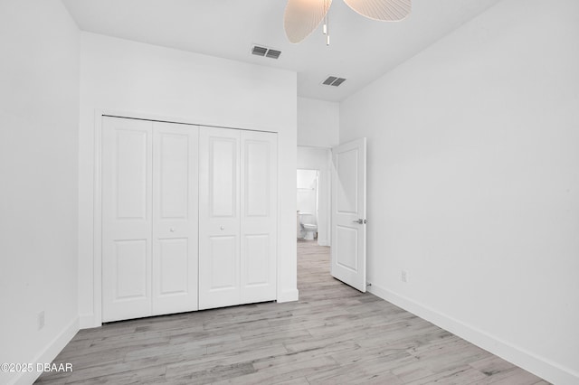 232 Ocean Hammock Loop, Daytona Beach, FL 32124 - unfurnished bedroom featuring light wood finished floors, visible vents, a closet, baseboards, and ceiling fan