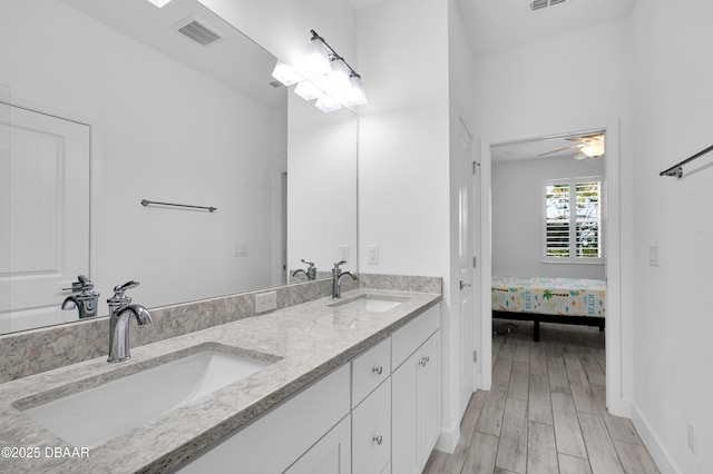 232 Ocean Hammock Loop, Daytona Beach, FL 32124 - full bathroom featuring wood finished floors, a sink, visible vents, and double vanity