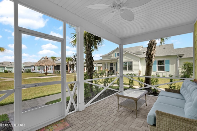 232 Ocean Hammock Loop, Daytona Beach, FL 32124 - sunroom featuring an outdoor living space, a ceiling fan, and a residential view