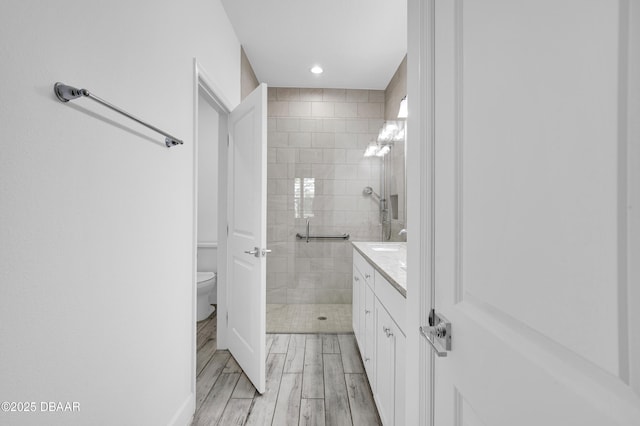 232 Ocean Hammock Loop, Daytona Beach, FL 32124 - full bathroom featuring vanity, wood finished floors, a shower stall, and toilet