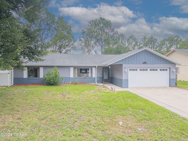 ranch-style house with a garage and a front yard