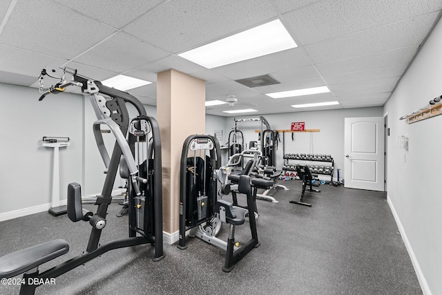 exercise room featuring a drop ceiling