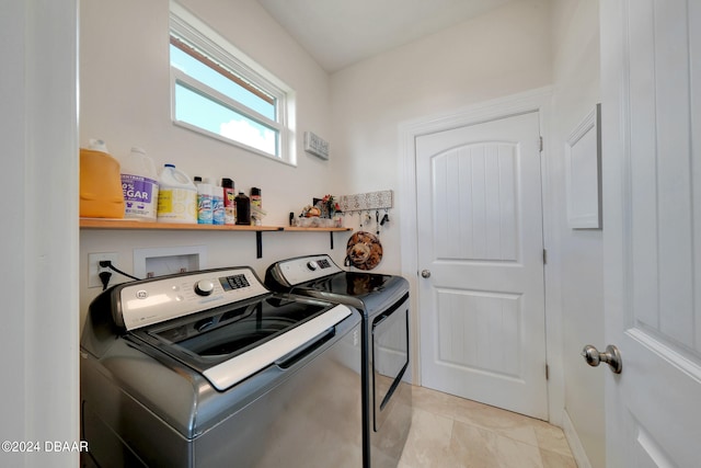 clothes washing area featuring washer and clothes dryer