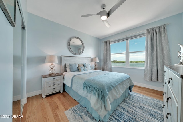 bedroom featuring light wood-type flooring and ceiling fan