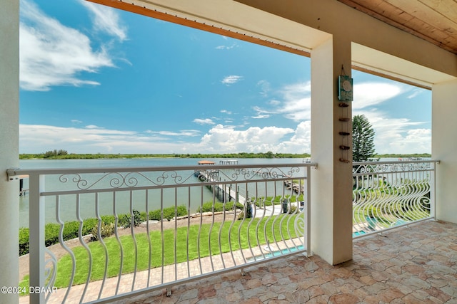 balcony featuring a water view