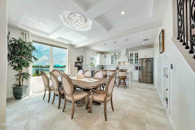 dining area featuring beamed ceiling, coffered ceiling, and an inviting chandelier