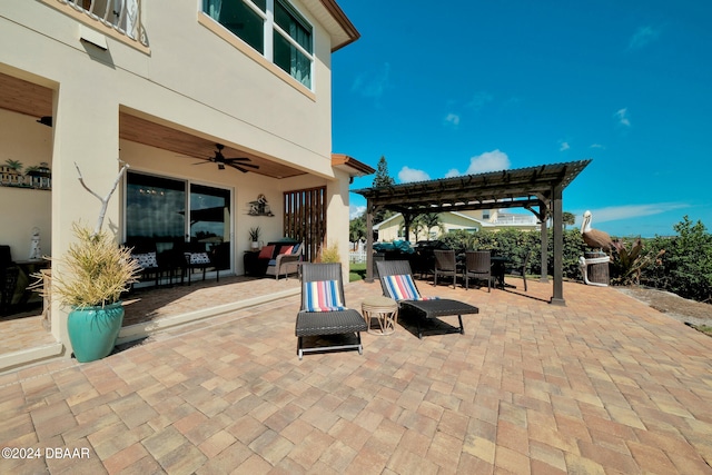 view of patio / terrace with ceiling fan and a pergola