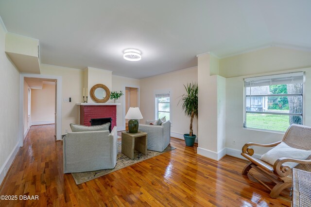 84 Lincoln Ave, Ormond Beach, FL 32174 - living room with wood finished floors, a fireplace, and baseboards
