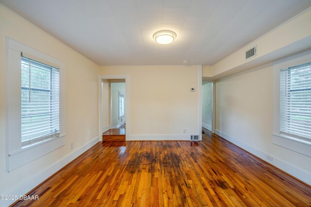 84 Lincoln Ave, Ormond Beach, FL 32174 - empty room featuring hardwood / wood-style flooring and baseboards
