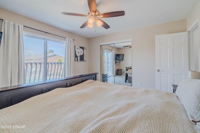 bedroom with ceiling fan and a closet