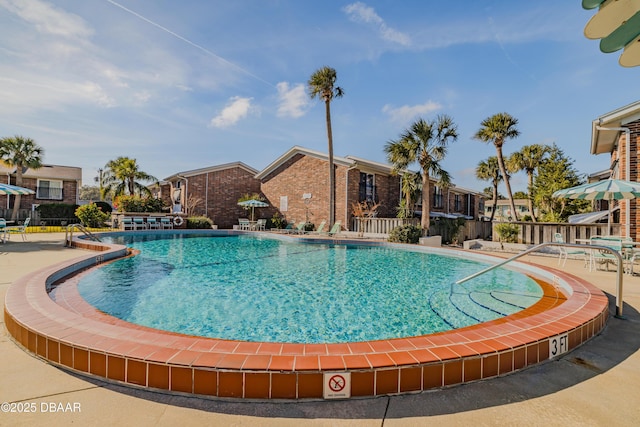 view of swimming pool featuring a patio area