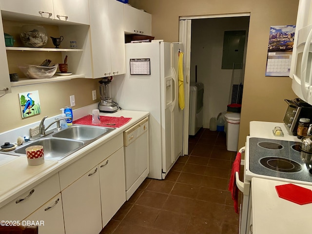 kitchen featuring electric panel, white appliances, light countertops, and a sink