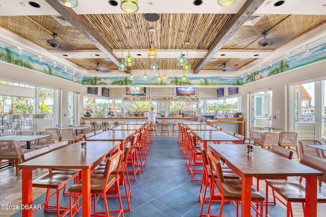 dining space with wooden ceiling, beam ceiling, and coffered ceiling