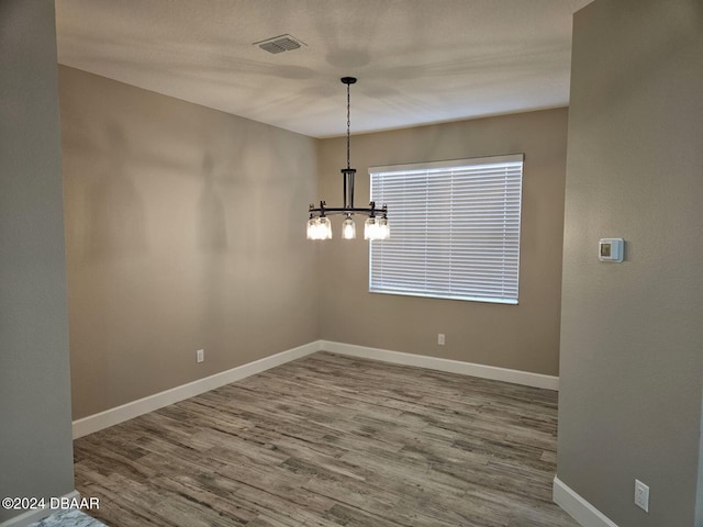 unfurnished dining area with hardwood / wood-style floors