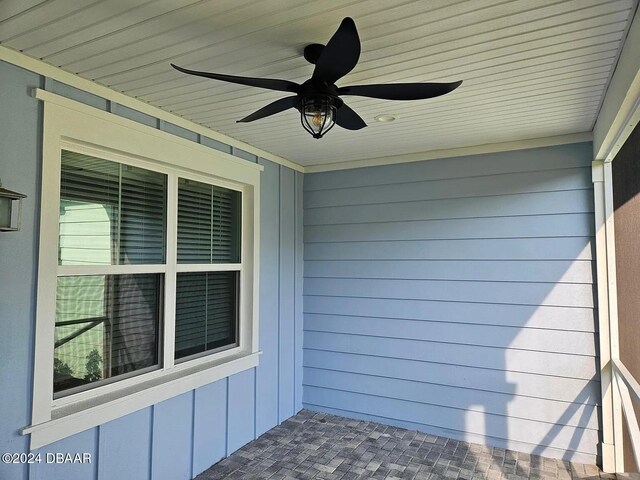 exterior space with ceiling fan