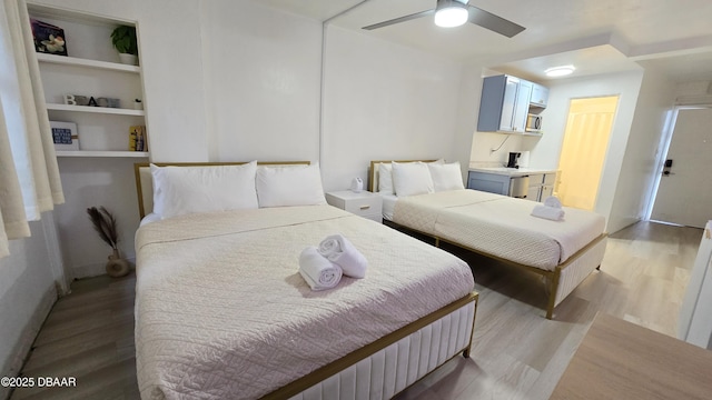 bedroom featuring ceiling fan and light hardwood / wood-style floors