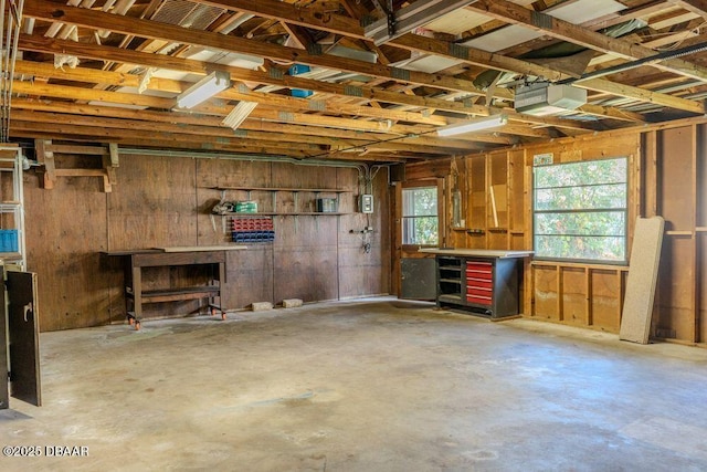 garage featuring a workshop area and a garage door opener