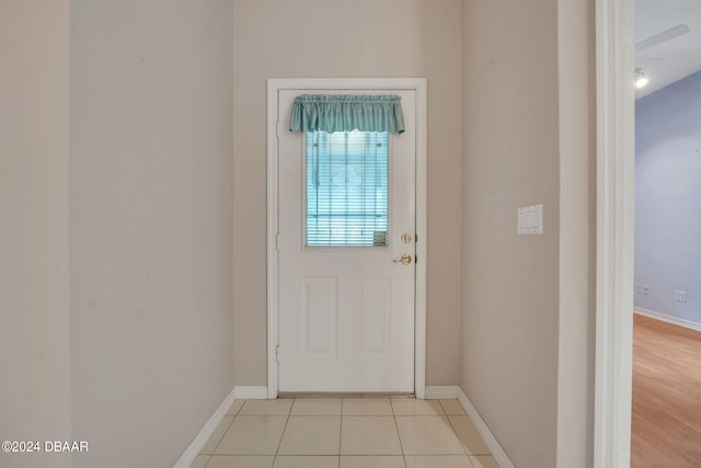 doorway with light wood-type flooring