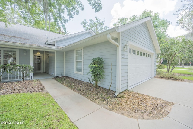 view of side of property featuring a garage