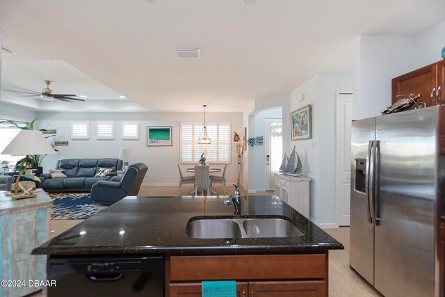 kitchen featuring sink, ceiling fan, black dishwasher, decorative light fixtures, and stainless steel fridge with ice dispenser