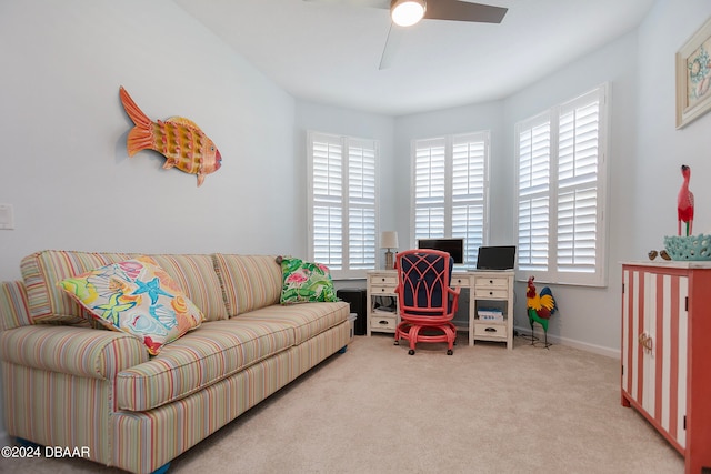 interior space with light carpet and ceiling fan