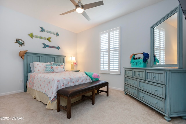 bedroom with light carpet and ceiling fan