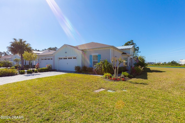 view of front of home featuring a garage and a front yard