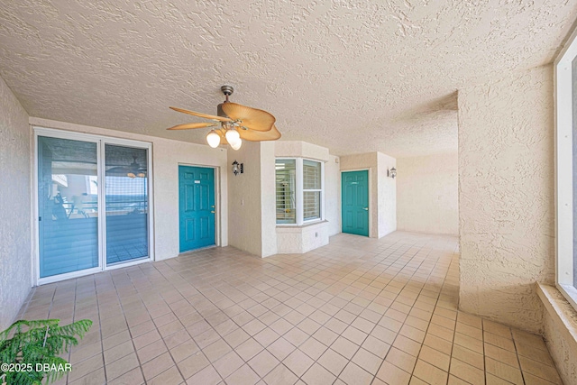 view of patio / terrace featuring ceiling fan