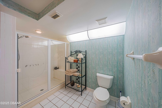 bathroom featuring walk in shower, toilet, and tile patterned flooring