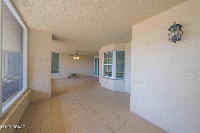 view of patio / terrace featuring ceiling fan