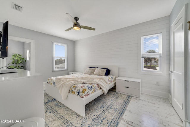 bedroom featuring ceiling fan and light hardwood / wood-style flooring