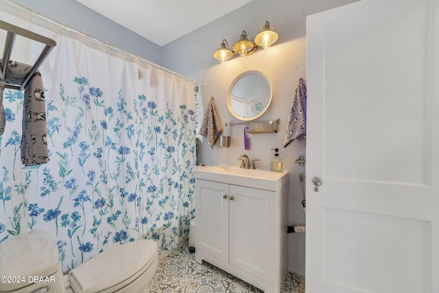 bathroom with toilet, vanity, and a shower with shower curtain