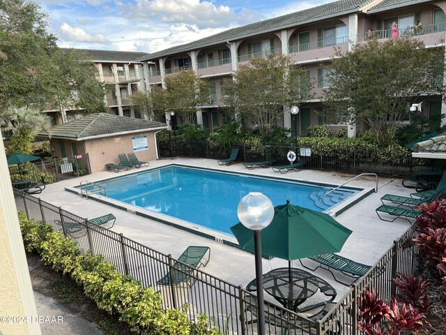 view of pool featuring a patio area