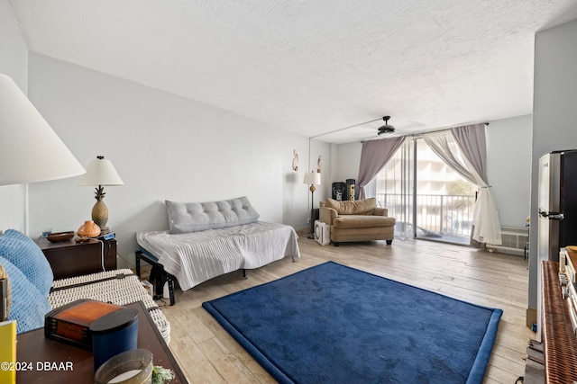 1233 S Atlantic Ave Unit 2230, Daytona Beach, FL 32118 - living room with hardwood / wood-style floors, ceiling fan, and a textured ceiling