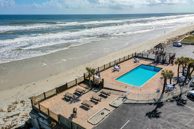 1233 S Atlantic Ave Unit 2230, Daytona Beach, FL 32118 - bird's eye view of waterfront with a beach and a pool area