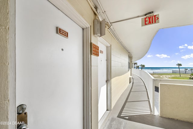 balcony with a view of the beach and a water view