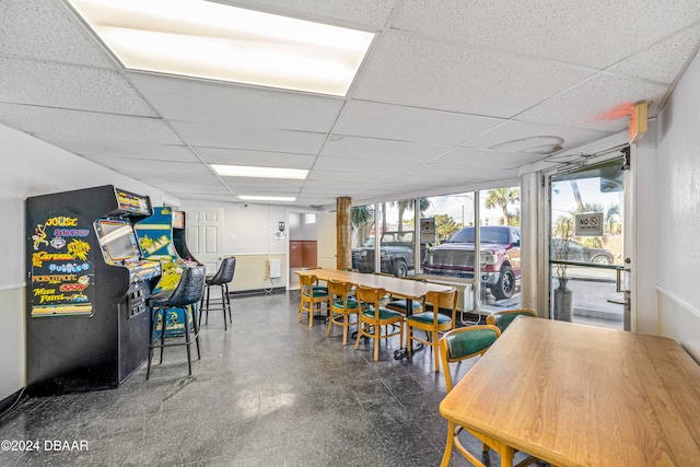 dining room with a drop ceiling