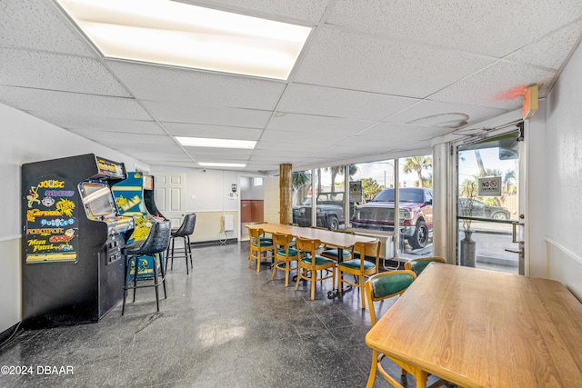 1233 S Atlantic Ave Unit 2230, Daytona Beach, FL 32118 - dining space featuring a drop ceiling, tile patterned floors, and baseboards