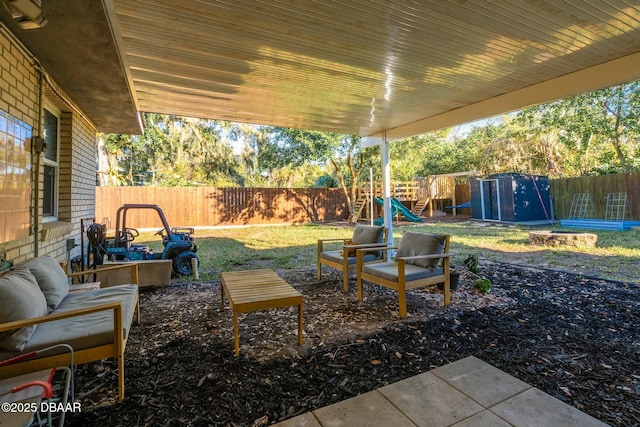 view of patio / terrace with a shed