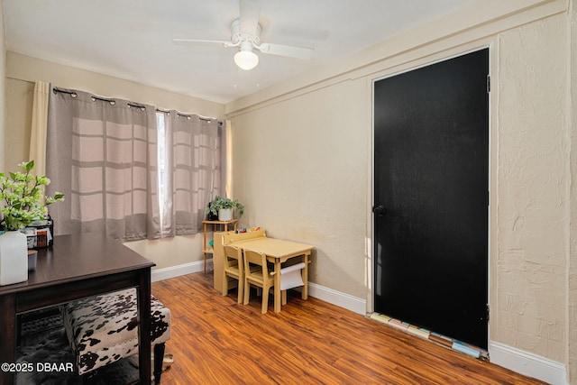 interior space with hardwood / wood-style floors and ceiling fan