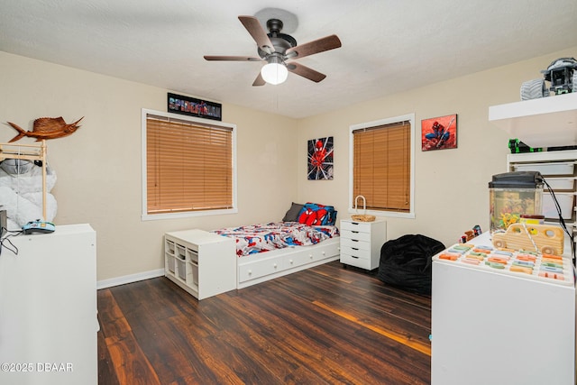 bedroom featuring dark hardwood / wood-style floors and ceiling fan