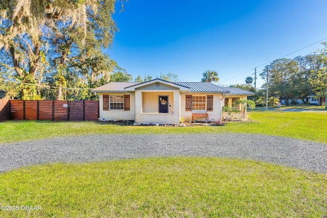 ranch-style house with a front yard